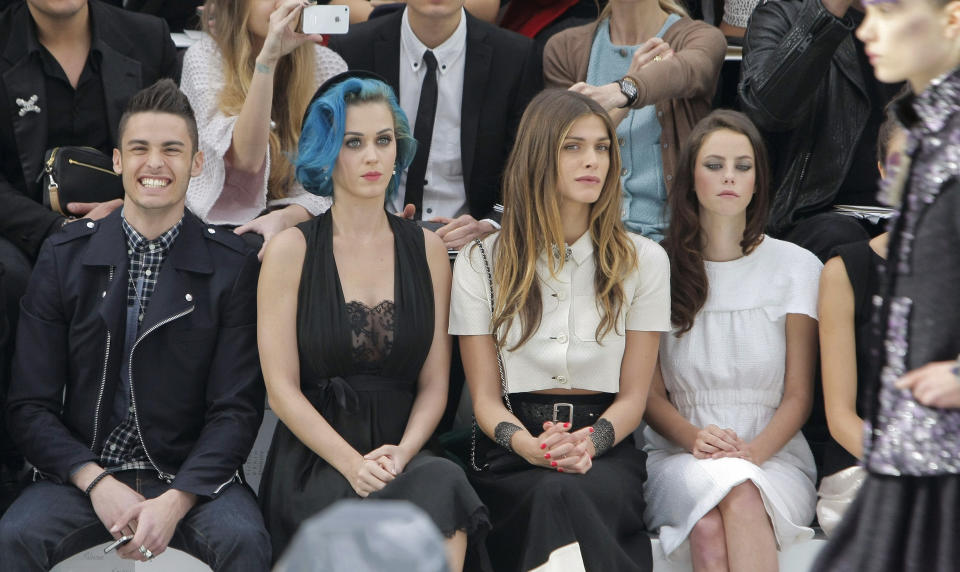From left, French model Baptiste Giacobini, U.S singer Katy Perry, Italian actress Elisa Sednaoui, and British actress Kaya Scodelario, attend Chanel fashion house presentation for Women's Fall-Winter, ready-to-wear 2013 fashion collection, during Paris Fashion week, Tuesday, March 6, 2012. (AP Photo/Thibault Camus)