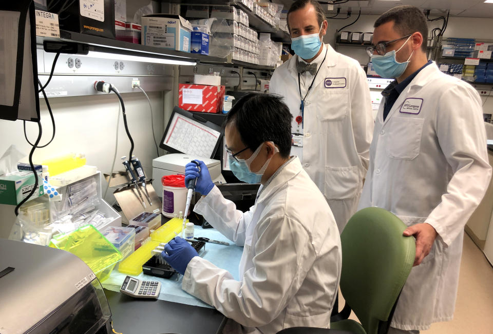 Pathologist and scientists at inside the molecular laboratory of NYU's Langone Medical Center test tissue samples of potentially missed Covid-19 cases, on July 10, 2020. (NBC News)