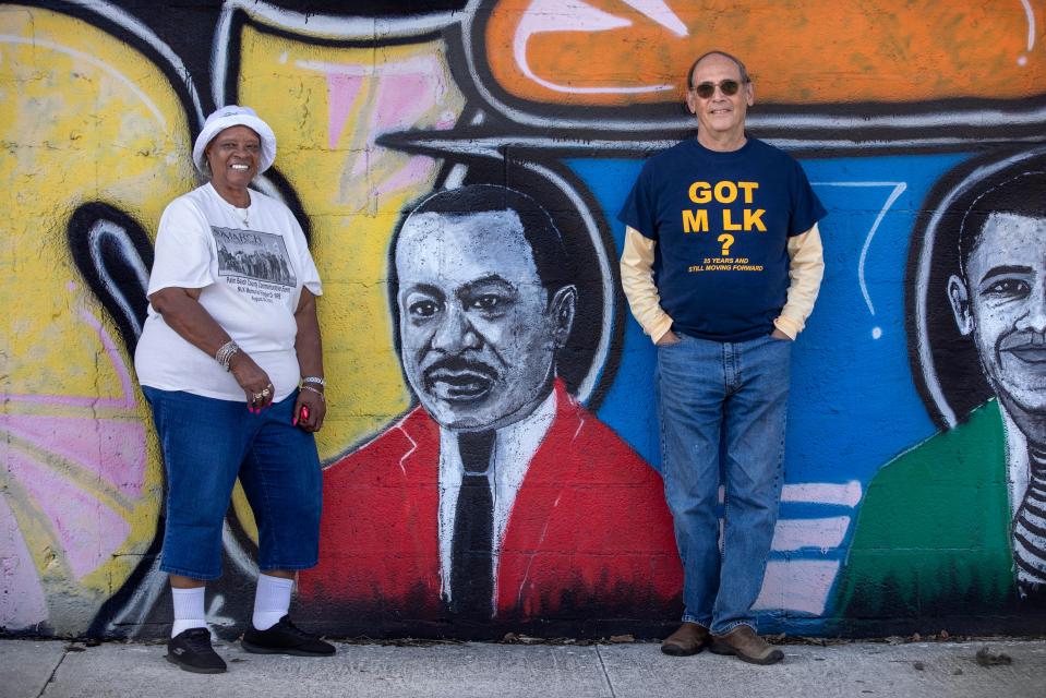 Former city commissioner Retha Lowe and author Ted Brownstein stand together at the Wall of Unity in Lake Worth Beach, Florida on January 10, 2024.