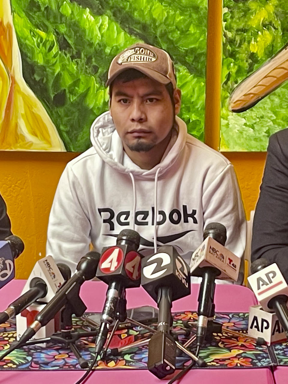 Pedro Romero Perez addresses the media during a press conference Friday, April 5, 2024, in Half Moon Bay, Calif. Perez, a migrant farmworker who survived a mass shooting at a Northern California mushroom farm, filed a lawsuit Friday against the farm owner, saying he failed to keep him safe from a co-worker who last year shot and killed his brother and three other co-workers before driving to another mushroom farm and killing three former colleagues. (AP Photo/Haven Daley)