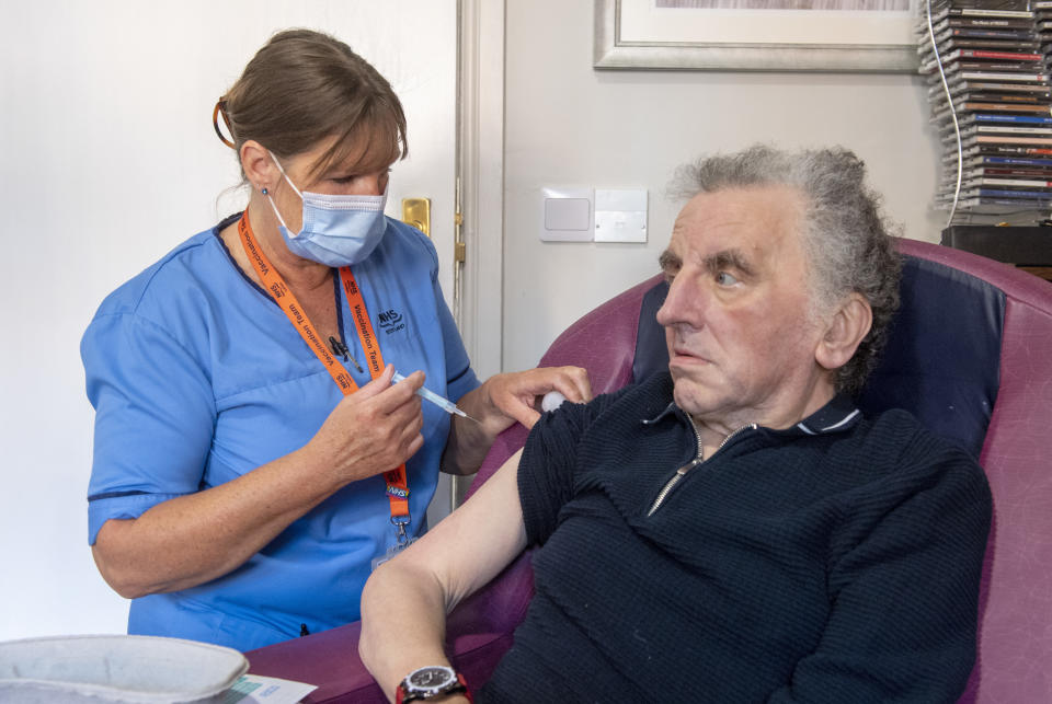 EDINBURGH, SCOTLAND - SEPTEMBER 05: Registered Nurse Laura Hastings administers a covid booster to Andrew Young, 72, at Victoria Manor Care home on September 5, 2022, in Edinburgh, Scotland. Today sees the launch of Scotland's winter Covid vaccine programme. (Photo by Lesley Martin - Pool/Getty images)
