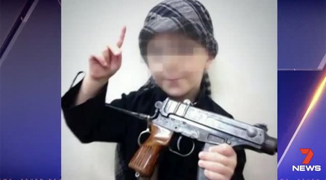 Khaled's child has been shown holding weapons in previous photos released on social media. Photo: 7 News