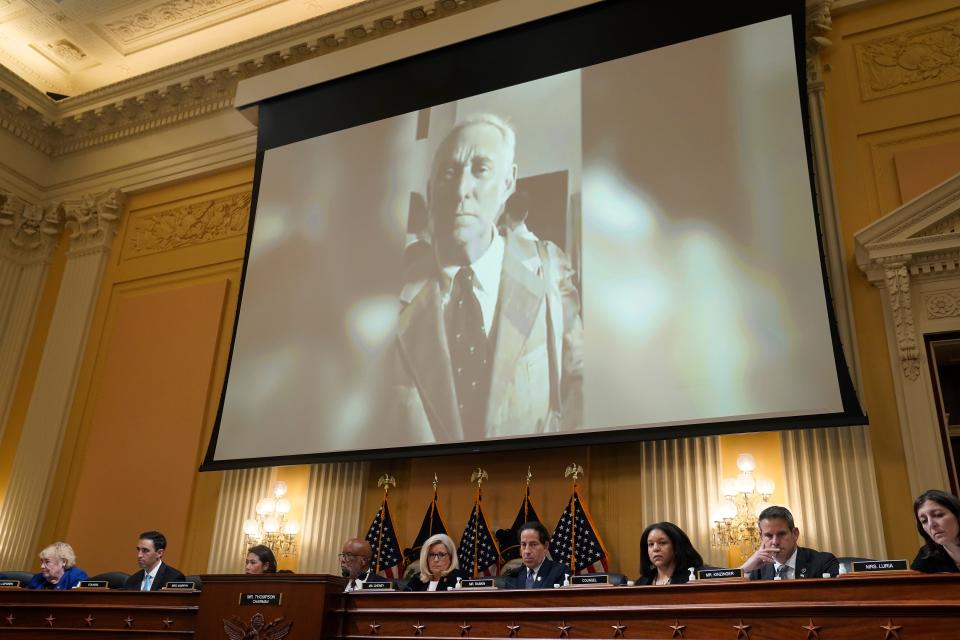 A video clip of Trump ally Roger Stone is projected on a large screen during a public hearing of the House Jan. 6 committee July 12.