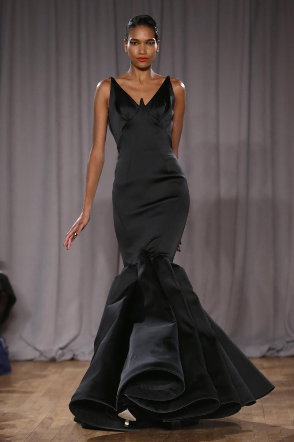 The Zac Posen Fall 2014 collection is modeled during Fashion Week in New York, Monday, Feb. 10, 2014. (AP Photo/Jason DeCrow)