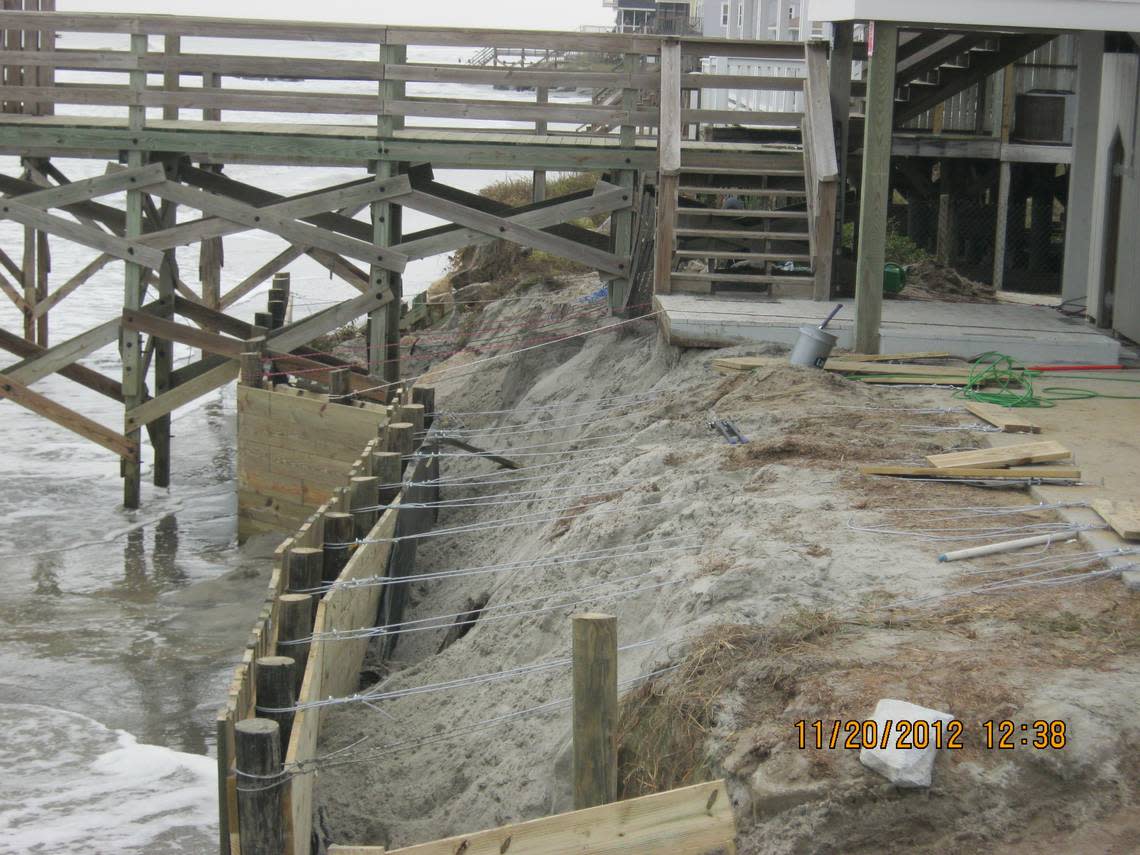 Property owners whose homes are threatened by rising seas are looking for ways to protect their investments. This photo from 2012 is of a seawall south of the Isle of Palms.