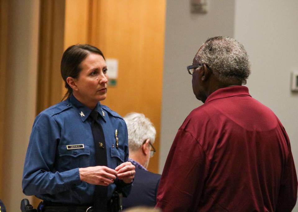 Kansas City Chief of Police Stacey Graves talks to a man attending a public safety symposium at the Kauffman Foundation Conference Center March 15, 2024. At the event, Graves presented Kansas City homicide data and ongoing efforts to address violence in the city.