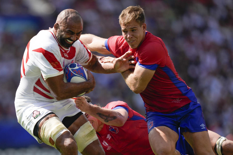 Japan's Michael Leitch, left, attempts to beat Chile’s Domingo Saavedra during the Rugby World Cup Pool D match between Japan and Chile at Stadium de Toulouse, Toulouse, France, Sunday, Sept. 10, 2023. (AP Photo/Lewis Joly)