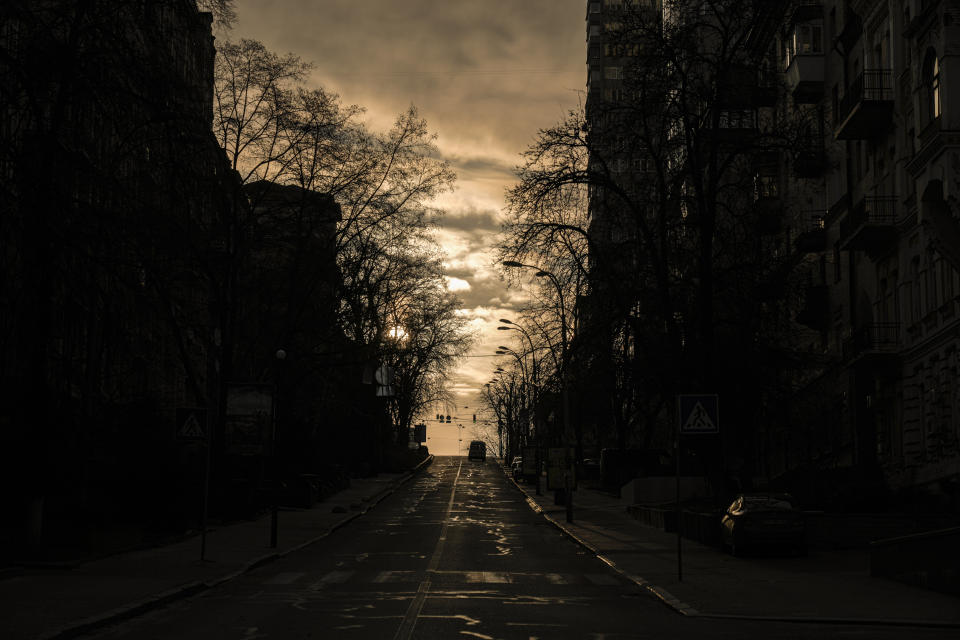 An ambulance drives in downtown Kyiv, Ukraine, Thursday, March 17, 2022, as a curfew in the Ukrainian capital comes to an end. (AP Photo/Vadim Ghirda)