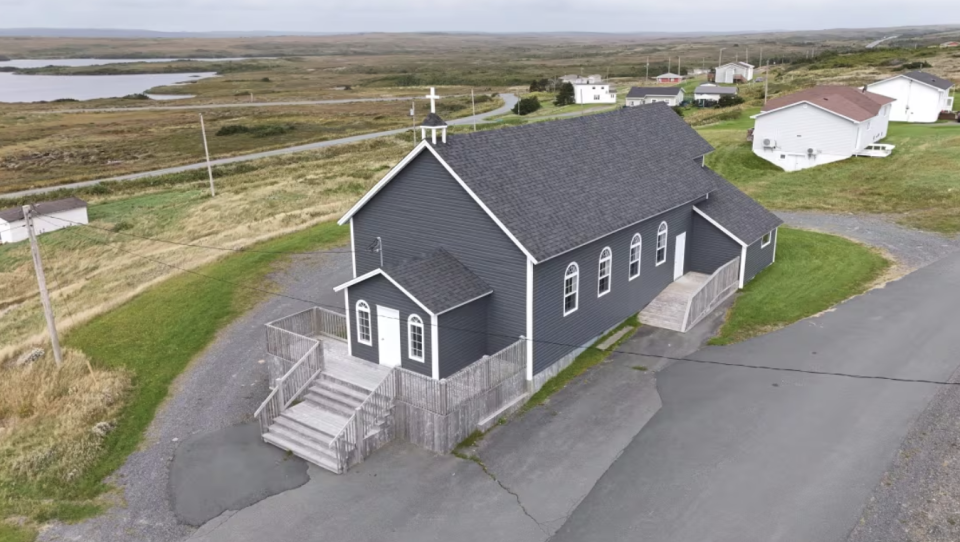 Holy Rosary church in Portugal Cove South underwent a renovation five years ago after local Catholics raised more than $130,000. The church is now for sale as the St. John's archdiocese liquidates assets through a court-supervised insolvency, but members of the congregation have changed the locks in order to keep out prospective buyers. (Danny Arsenault/CBC)