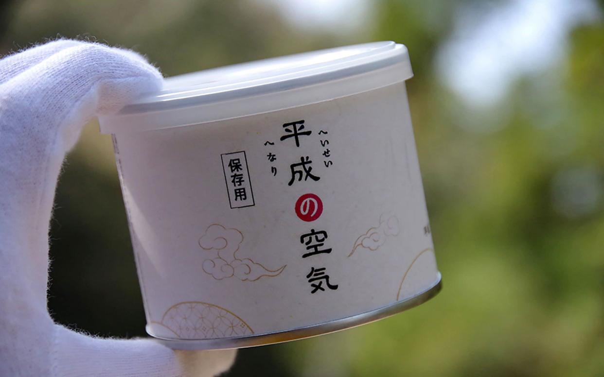 A can containing the air of Japan's outgoing Heisei era - AFP