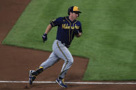 Milwaukee Brewers' Jedd Gyorko runs the bases after hitting a solo home run in the fifth inning during a baseball game against the Cincinnati Reds in Cincinnati, Monday, Sept. 21, 2020. (AP Photo/Aaron Doster)