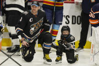 Washington Capitals' Alex Ovechkin (8) and his son waits for the events to start during the NHL All Star Skills Showcase,Friday, Feb. 3, 2023, in Sunrise, Fla. (AP Photo/Marta Lavandier)