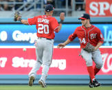 LOS ANGELES, CA - APRIL 28: Bryce Harper #34 and Ian Desmond #20 of the Washington Nationals react as the ball off the bat of Tony Gwynn #10 of the Los Angeles Dodgers falls in for a single during the third inning at Dodger Stadium on April 28, 2012 in Los Angeles, California. (Photo by Harry How/Getty Images)