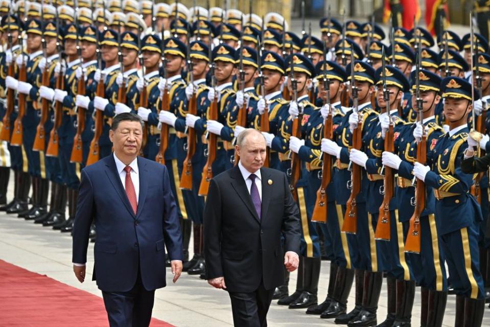 Chinese President Xi Jinping (L) and Russian President Vladimir Putin attend an official welcoming ceremony in front of the Great Hall of the People in Tiananmen Square in Beijing, China, on May 16, 2024, on the first day of Putin's state visit to China. (Sergei Bobylyov/POOL/AFP via Getty Images)