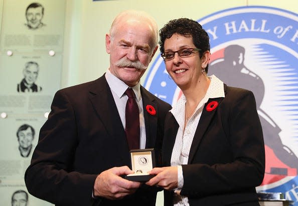 TORONTO, ON - NOVEMBER 10: Chairman of the Hockey Hall of Fame Lanny McDonald presents Danielle Goyette with the Hall ring during a media opportunity at the Hockey Hall Of Fame and Museum on November 10, 2017 in Toronto, Canada. (Photo by Bruce Bennett/Getty Images)