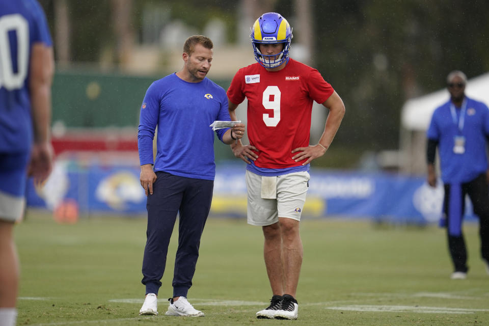 Los Angeles Rams head coach Sean McVay and quarterback Matthew Stafford (9) participates in drills at the NFL football team's practice facility in Irvine, Calif. Sunday, July 31, 2022. (AP Photo/Ashley Landis)