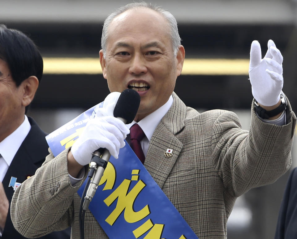 FILE - In this Jan. 25, 2014 file photo, former Health Minister Yoichi Masuzoe, a candidate for the Tokyo gubernatorial election, delivers a speech during his election campaign rally in Tokyo. Two charismatic former prime ministers joining forces on a rare anti-nuclear power ticket are pitted against Masuzoe and a human-rights activist in the election to lead Japan's capital. Japanese media polls say Masuzoe, more moderate on nuclear power, is leading. A lawyer known for human rights cases and a former military officer are also running. (AP Photo/Koji Sasahara, File)