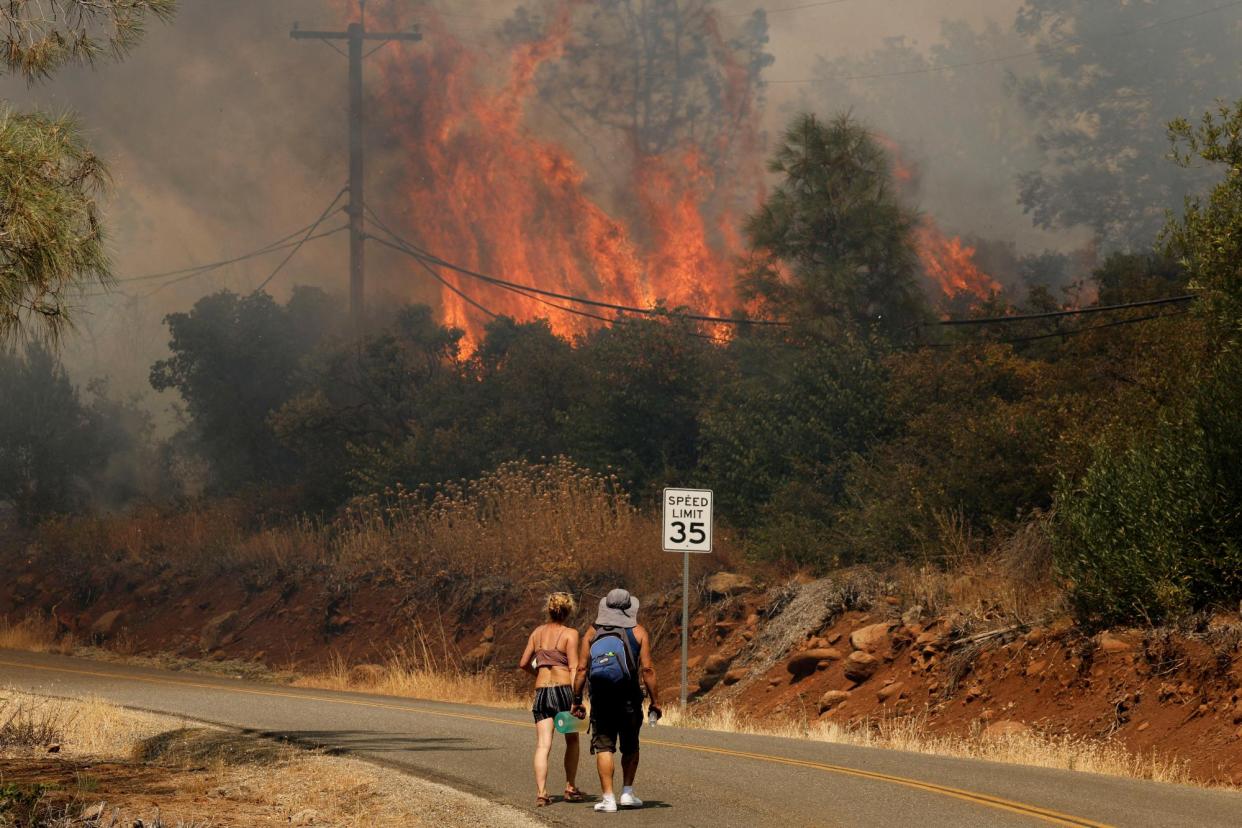 <span>The Park fire rages near Chico, California, on 25 July 2024.</span><span>Photograph: Fred Greaves/Reuters</span>