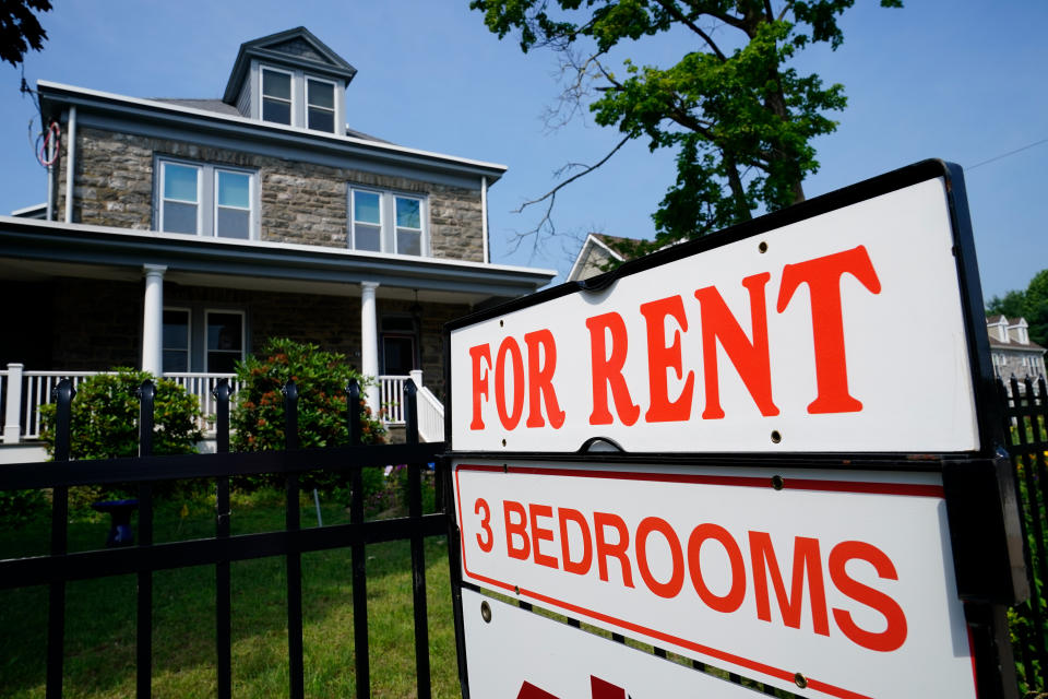 A sign indicating the availability of a home to rent stands outside a building in Philadelphia, Wednesday, June 22, 2022. (AP Photo/Matt Rourke)