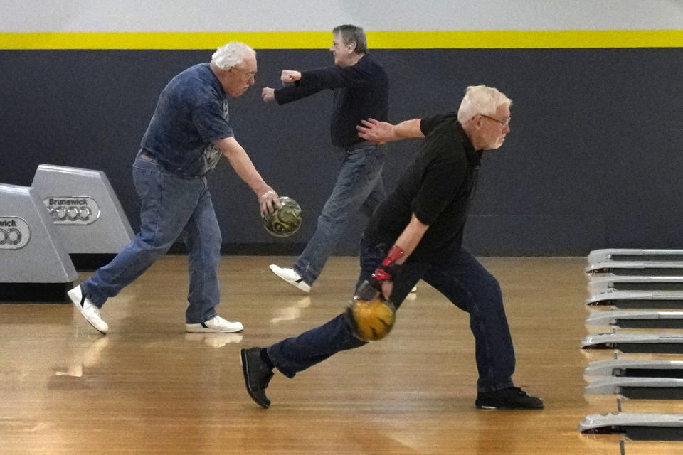 League bowlers compete at Just In Time Recreation, Wednesday, May 1, 2024, in Lewiston, Maine. The bowling alley was scheduled to reopen Friday, May 3, seven months after the state's deadliest mass shooting. (AP Photo/Robert F. Bukaty)