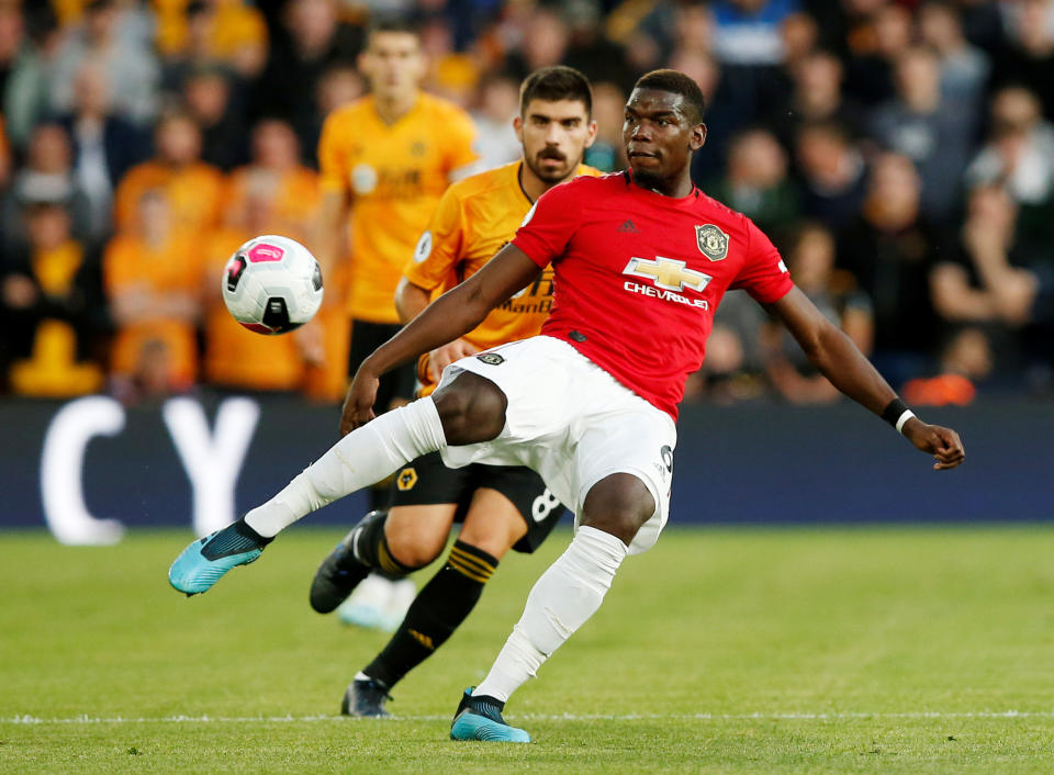 Soccer Football - Premier League - Wolverhampton Wanderers v Manchester United - Molineux Stadium, Wolverhampton, Britain - August 19, 2019   Manchester United's Paul Pogba in action   REUTERS/Andrew Yates    EDITORIAL USE ONLY. No use with unauthorized audio, video, data, fixture lists, club/league logos or "live" services. Online in-match use limited to 75 images, no video emulation. No use in betting, games or single club/league/player publications.  Please contact your account representative for further details.