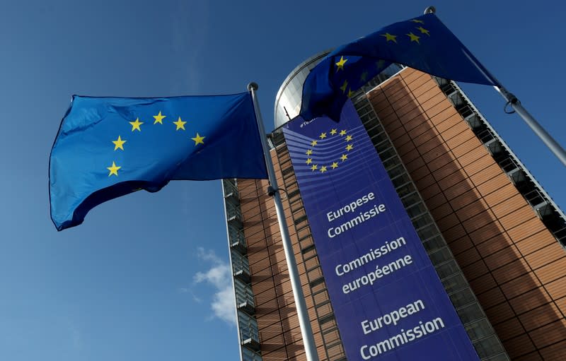 FILE PHOTO: European Union flags flutter outside the European Commission in Brussels