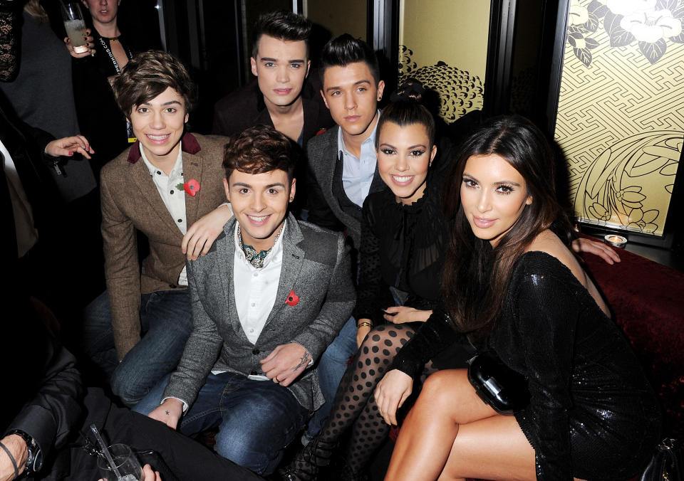 LONDON, ENGLAND - NOVEMBER 08:  (EMBARGOED FOR PUBLICATION IN UK TABLOID NEWSPAPERS UNTIL 48 HOURS AFTER CREATE DATE AND TIME. MANDATORY CREDIT PHOTO BY DAVE M. BENETT/GETTY IMAGES REQUIRED)  (L to R) X Factor finaliists George Shelley, Jaymi Hensley, Josh Cuthbert and Jamie Hamblett of Union J pose with Kourtney Kardashian an Kim Kardashian at the Kardashian Kollection launch for Dorothy Perkins at Aqua on November 8, 2012 in London, England.  (Photo by Dave M. Benett/Getty Images)