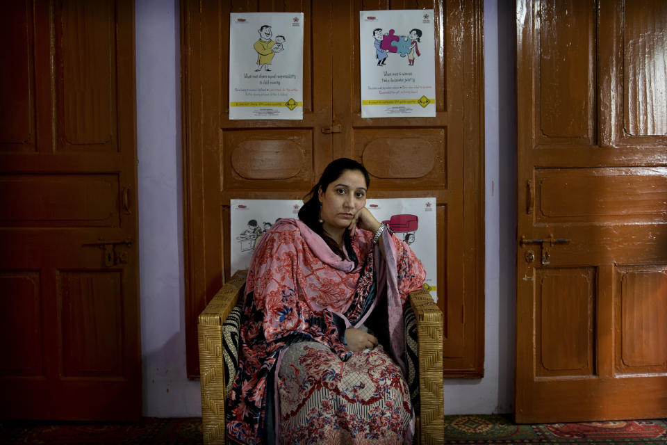 In this Thursday, Oct. 24, 2019, photo, Mantasha Binti Rashid, founder of Kashmir Women's Collective, sits for a photograph in Srinagar, Indian-controlled Kashmir. Since the lockdown, her organization has seen a marked rise in violence against women as victims do not have a way to reach out for help. She cites examples: a woman attacked and brought to a hospital 90% covered with burns, many beaten by husbands or thrown out of their homes, another who faced abandonment. “Women suffer disproportionately,” she said. (AP Photo/ Dar Yasin)