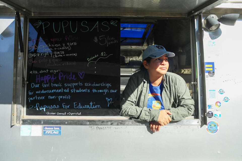 Cecilia Polanco in the window of her Pupusa truck in Durham, N.C., on Oct. 22, 2022.  (Alex Mousan for NBC News)