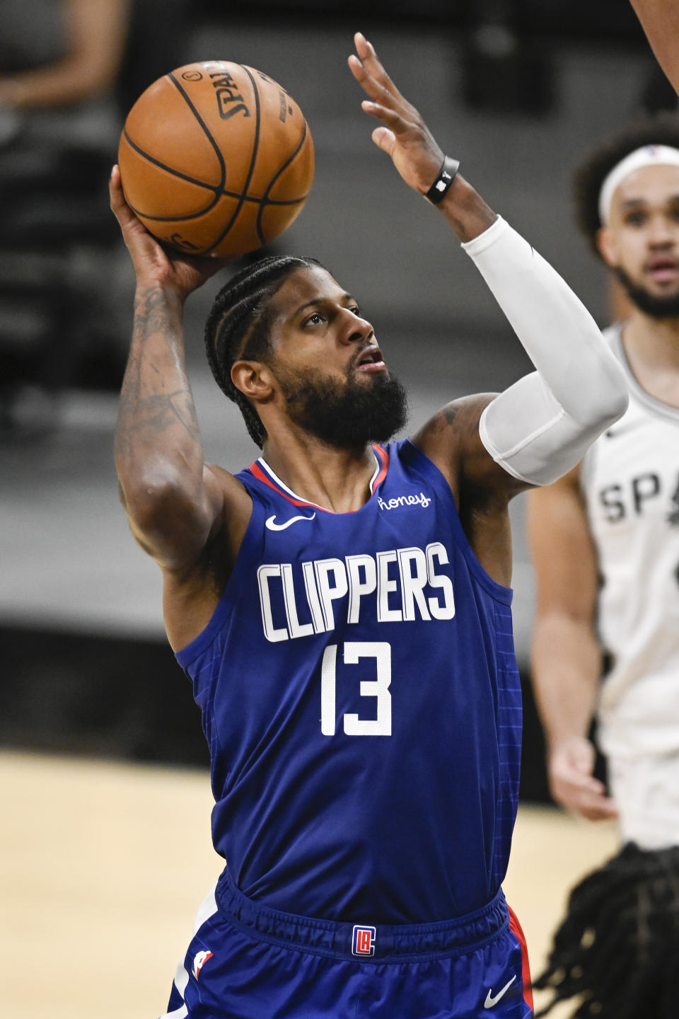 Los Angeles Clippers' Paul George shoots during the second half of an NBA basketball game against the San Antonio Spurs on Wednesday, March 24, 2021, in San Antonio. Los Angeles won 134-101. (AP Photo/Darren Abate)