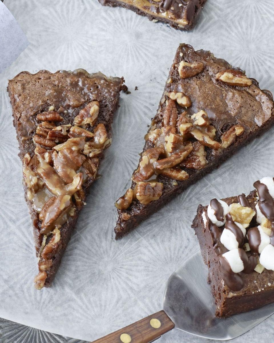 <p>Rich pecans and chocolate are a match made in dessert heaven. These brownies are an easy sweet treat for any occasion.</p><p><strong><a href="https://www.countryliving.com/food-drinks/recipes/a3525/brownie-pecan-tart-recipe-clv1210/" rel="nofollow noopener" target="_blank" data-ylk="slk:Get the recipe for Brownie Pecan Tart" class="link ">Get the recipe for Brownie Pecan Tart</a>.</strong></p>
