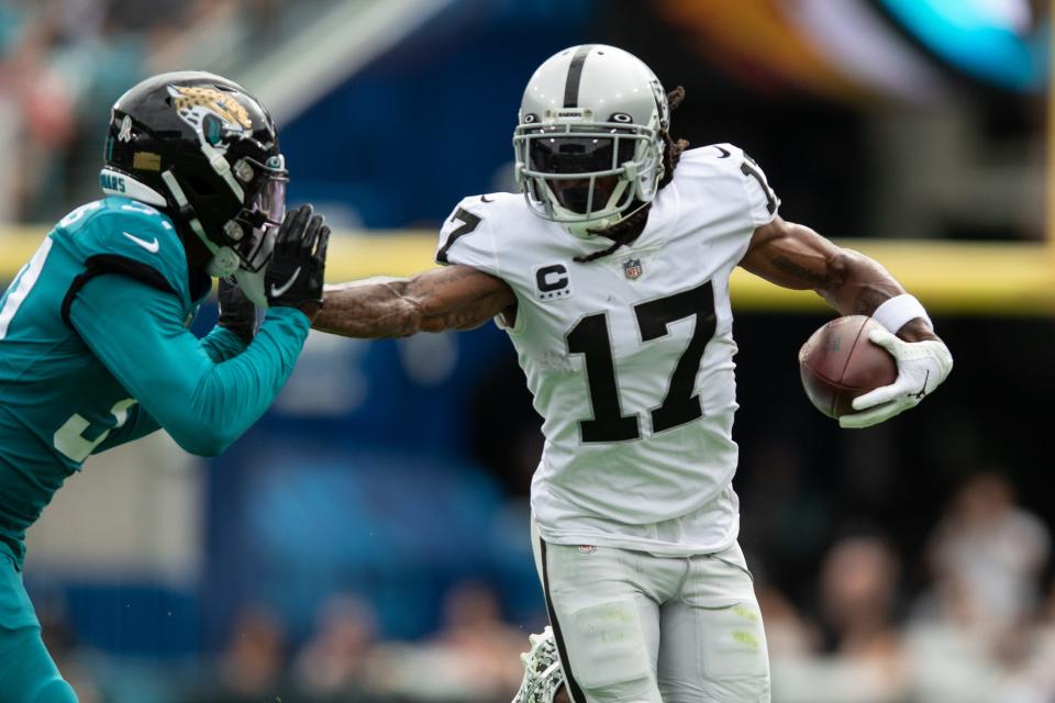 Las Vegas Raiders wide receiver Davante Adams (17) runs the ball after the catch against the Jacksonville Jaguars in the first quarter at TIAA Bank Field.