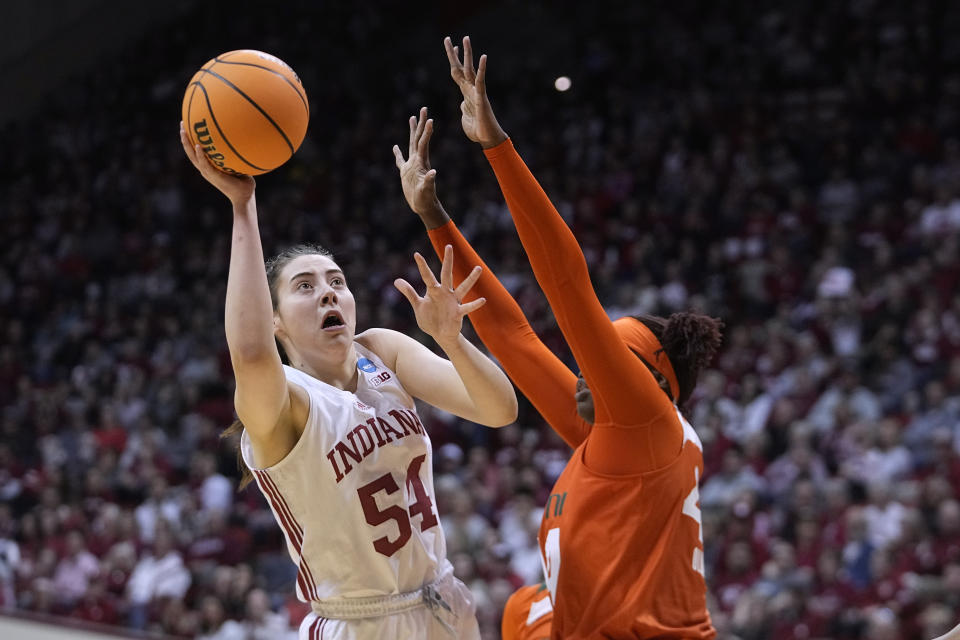 Indiana's Mackenzie Holmes (54) shoots over Miami's Kyla Oldacre during the first half of a second-round college basketball game in the women's NCAA Tournament Monday, March 20, 2023, in Bloomington, Ind. (AP Photo/Darron Cummings)