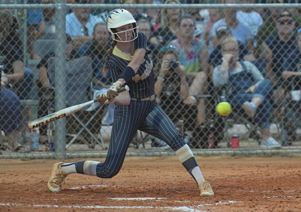 Kiersten Taylor (1) singles for Eustis during Monday's Class 4A-Region 2 championship game against Deltona at the Panther Den in Eustis.