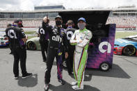 Drivers Jimmie Johnson, left, and Ross Chastain watch along pit road during qualifying for a NASCAR Cup Series auto race at Charlotte Motor Speedway Sunday, May 24, 2020, in Concord, N.C. (AP Photo/Gerry Broome)