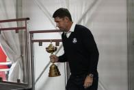 Team Europe captain Padraig Harrington carries in the trophy at a new conference for the Ryder Cup at the Whistling Straits Golf Course Monday, Sept. 20, 2021, in Sheboygan, Wis. (AP Photo/Morry Gash)