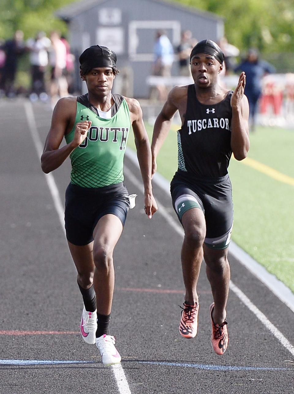 South Hagerstown's Deontae Blake, left, placed first in the boys 400 and third in the 200 at the 3A West region championships.