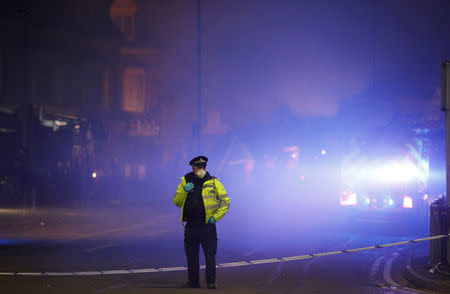 Members of the emergency services work at the site of an explosion which destroyed a convenience store and a home in Leicester, Britain, February 25, 2018. REUTERS/Darren Staples