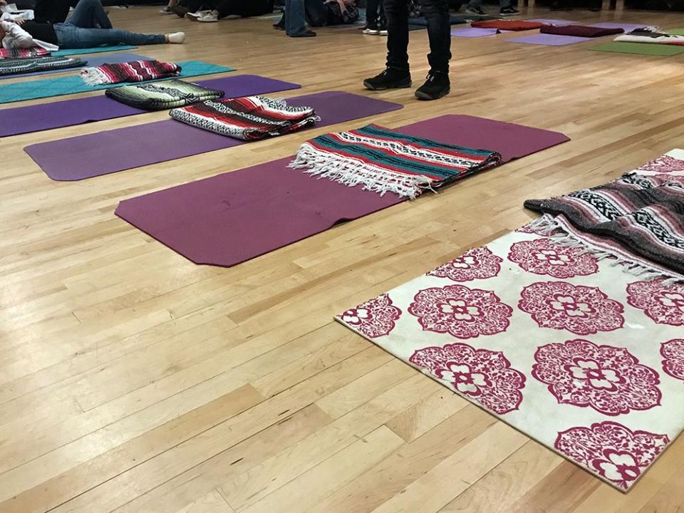 Yoga mats are lined up in the theater room at Taos High in New Mexico ahead of a meditation activity meant to help students develop new skills to deal with grief and loss.