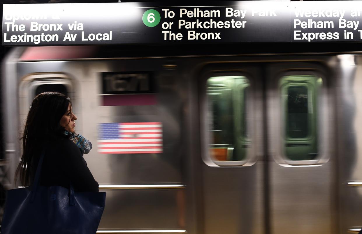 A woman waits to catch her train in a subway station in New York on September 25, 2014. Iraq's Prime Minister Haider al-Abadi, who is attending the 69th session of the United Nations General Assembly in New York, said his country's intelligence operation has uncovered a plot for an attack on subway systems in the United States and Paris. AFP PHOTO/Jewel Samad        (Photo credit should read JEWEL SAMAD/AFP via Getty Images)