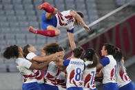 France players throw team captain Fanny Horta into the air, after the team lost to New Zealand in the women's rugby gold medal match, at the 2020 Summer Olympics, Saturday, July 31, 2021 in Tokyo, Japan. (AP Photo/Shuji Kajiyama)