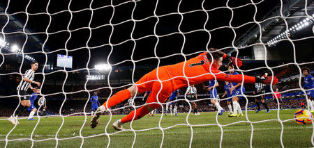 Soccer Football - Premier League - Chelsea v Newcastle United - Stamford Bridge, London, Britain - January 12, 2019 Newcastle United's Ciaran Clark (hidden) scores their first goal past Chelsea's Kepa Arrizabalaga Action Images via Reuters/Andrew Couldridge EDITORIAL USE ONLY. No use with unauthorized audio, video, data, fixture lists, club/league logos or "live" services. Online in-match use limited to 75 images, no video emulation. No use in betting, games or single club/league/player publications. Please contact your account representative for further details.