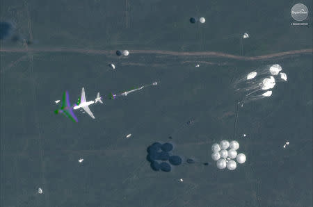 A satellite image shows an airborne paradrop in progress during the Russian military exercise known as Vostok 2018, conducted at the Tsugol training area in eastern Russia, September 13, 2018. Satellite image ©2018 DigitalGlobe, a Maxar company/Handout via REUTERS