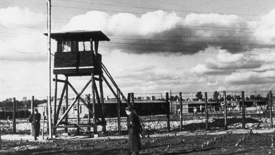 The camp was encircled by barbed wire fences and a series of watchtowers manned by armed guards. - Hulton Archive/Getty Images