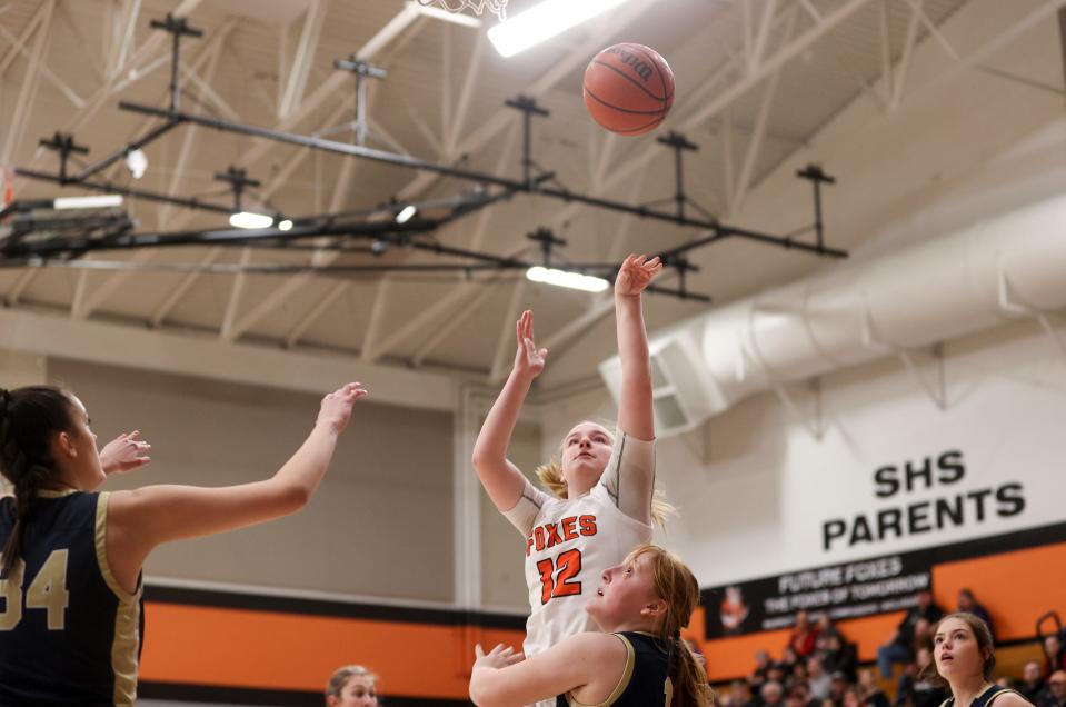 Silverton's Kyleigh Brown (12) shoots the ball against Canby during the first half at Silverton High School, Friday, March 3, 2023, in Silverton, Ore.