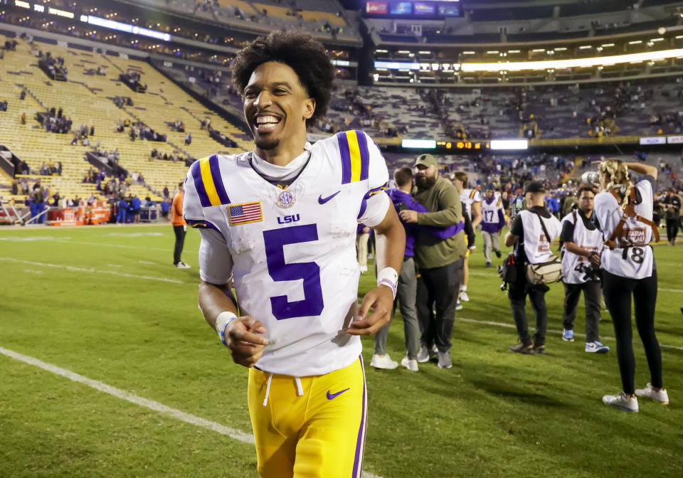 LSU quarterback Jayden Daniels (5) runs off the field following a win over Florida in an NCAA college football game in Baton Rouge, La., Saturday, Nov. 11, 2023. (AP Photo/Derick Hingle)