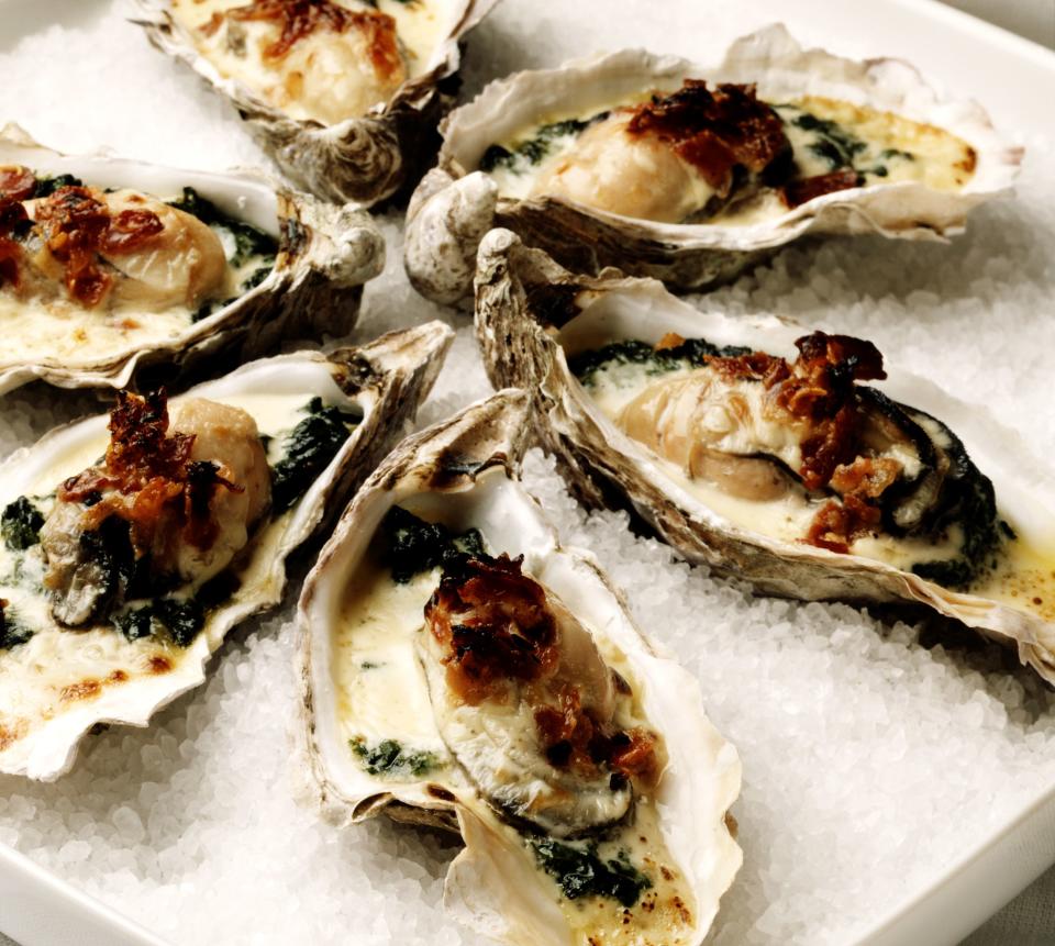 Oysters Rockefeller are baked or broiled with a rich sauce of butter, herbs and breadcrumbs. (Photo: Peter Williams via Getty Images)