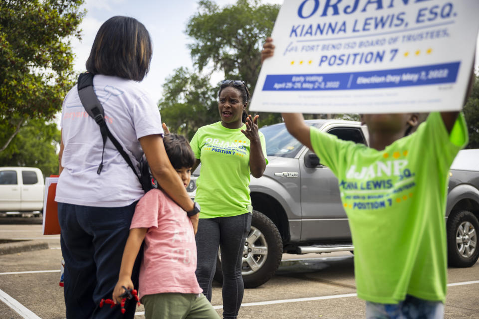 School board trustee hopeful Orjanel Lewis chats with supporters during her Election Day campaigning on May 7, 2022, in Ft. Bend County, Texas. (Annie Mulligan for NBC News)