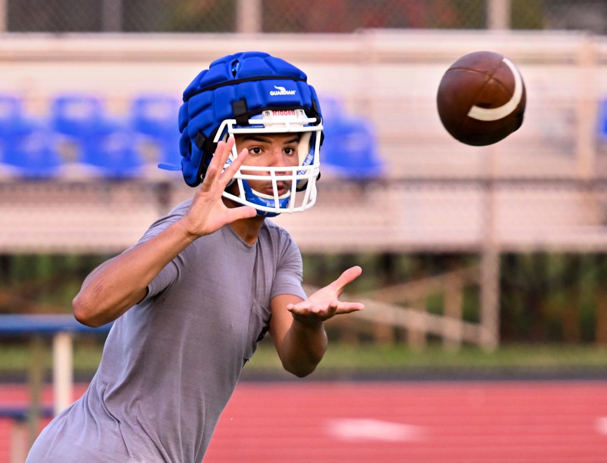 Mashpee receiver Makai Hue takes in a pass during practice.