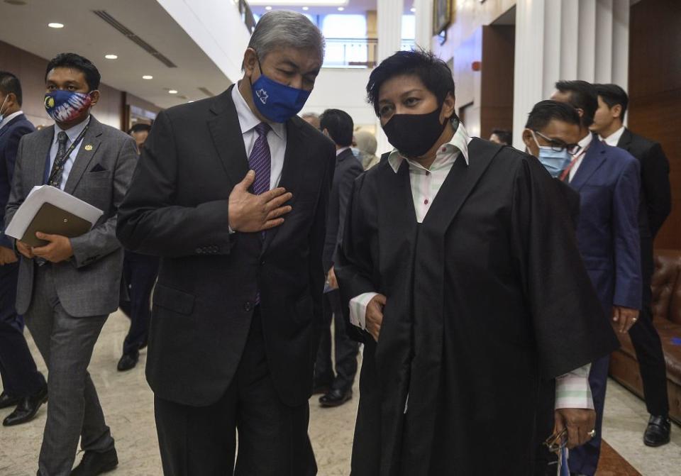 Bagan Datuk MP Datuk Seri Ahmad Zahid Hamidi speaks to Dewan Rakyat Deputy Speaker Datuk Seri Azalina Othman in Parliament, Kuala Lumpur August 18, 2020. ― Picture by Miera Zulyana